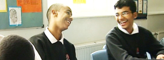 Pupils laughing in classroom